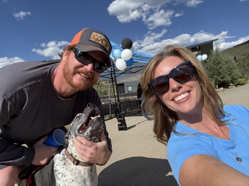 A happy dog and its owner at the Cement Creek event