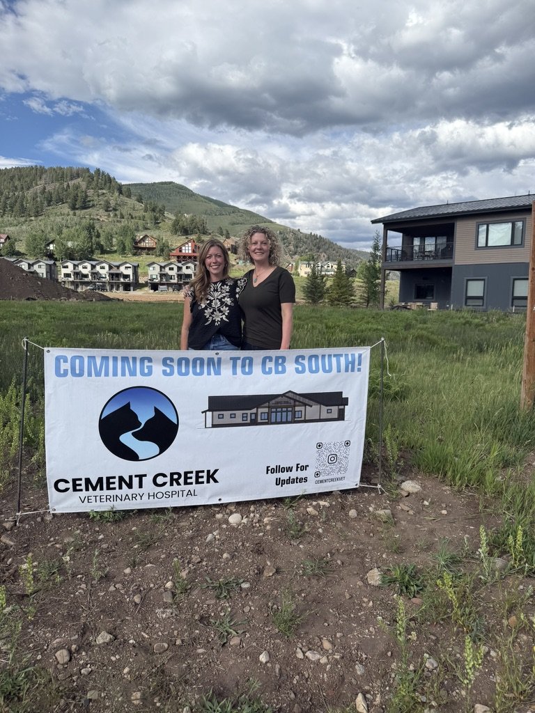 The Cement Creek team with the Coming Soon to CB South banner