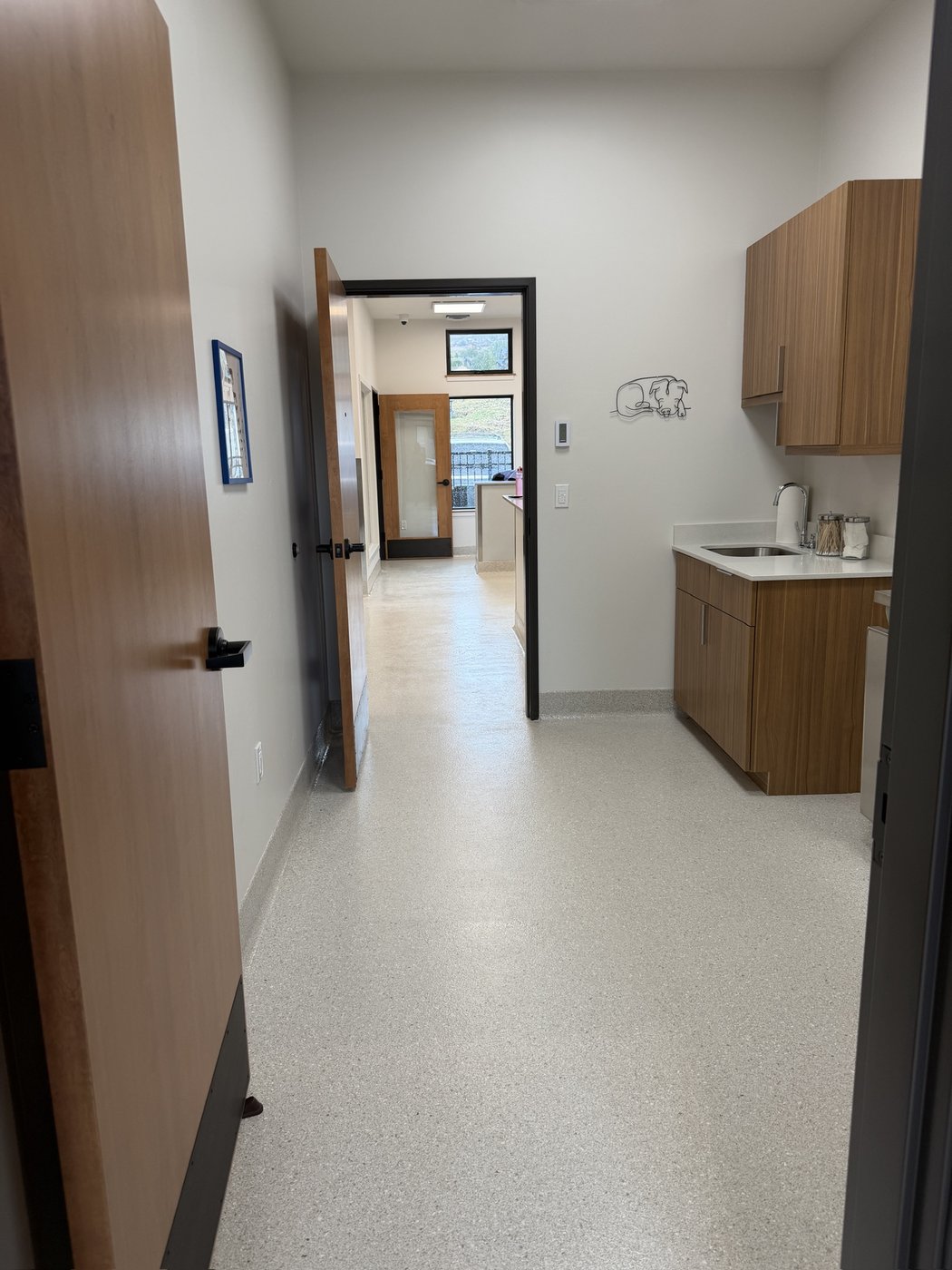 The finished staff kitchenette at the end of a hallway