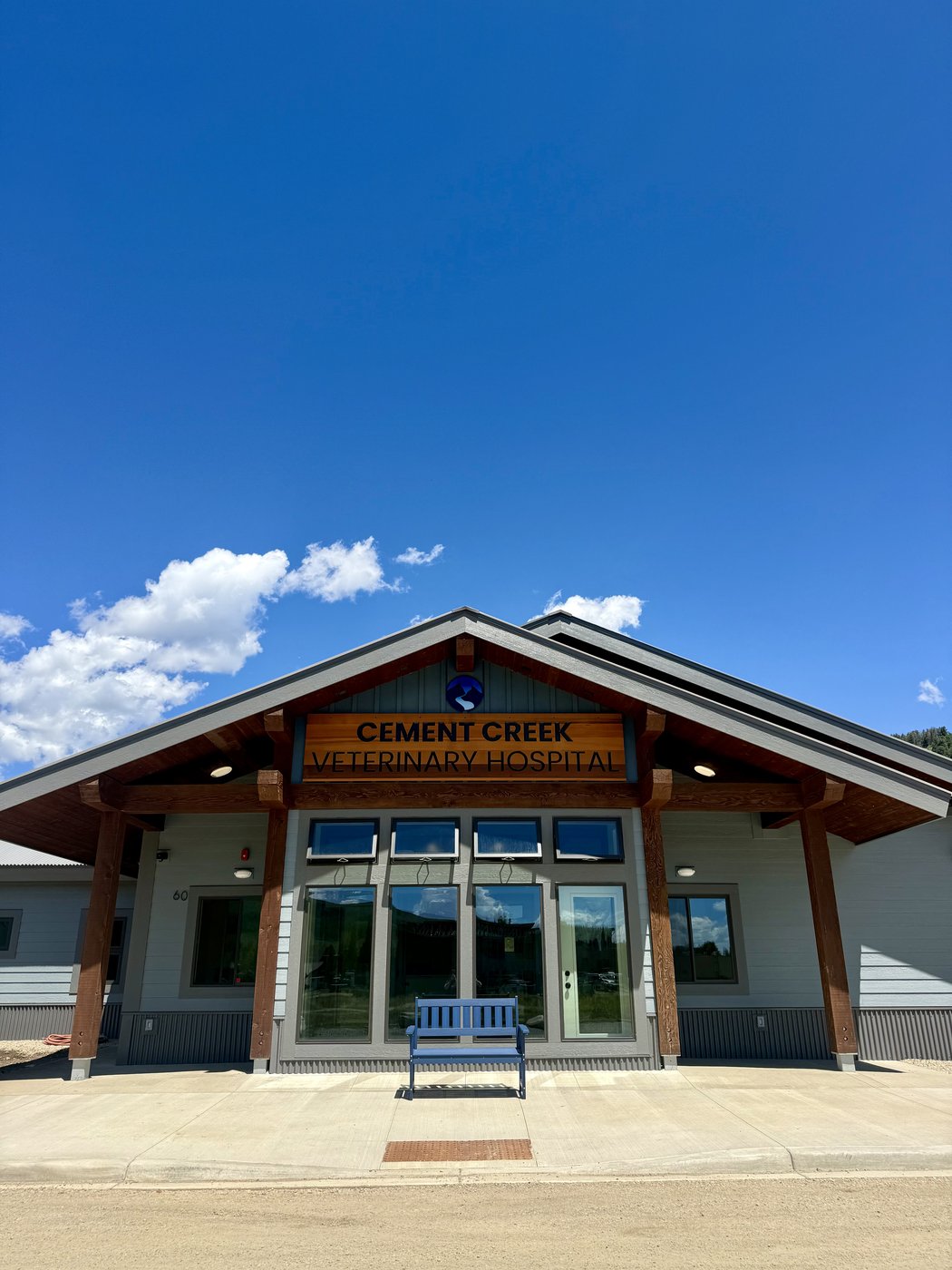 The completed Cement Creek Veterinary Hospital under a bright blue sky